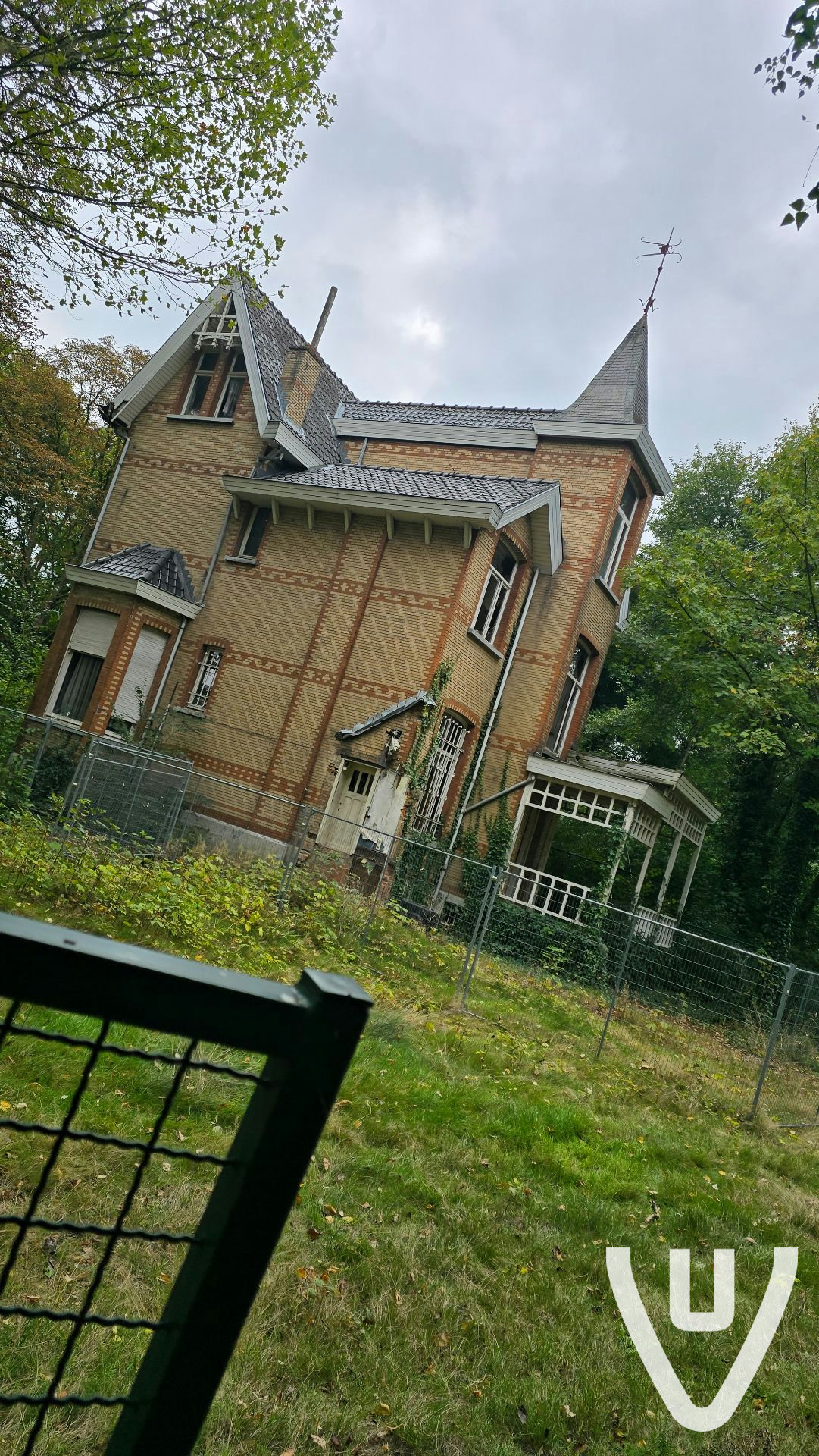 There is a fence around the house but its open